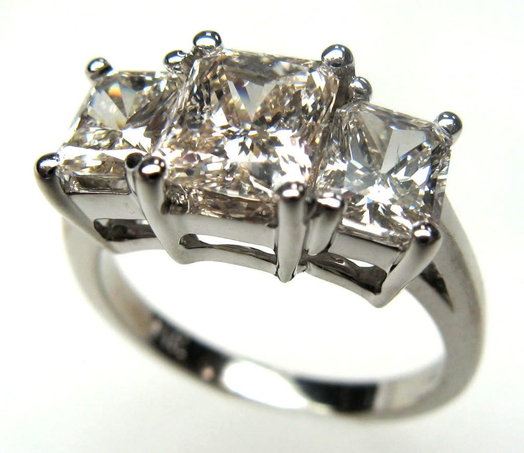 2.6 Carat Three Stone Radiant Diamond Ring set in 14K White Gold.