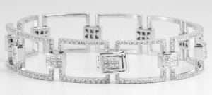 An 18k white gold square diamond bracelet set with princess and round cut diamonds