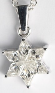 A diamond pendant in the shape of a Star of David, set in 18 karat white gold with a chain