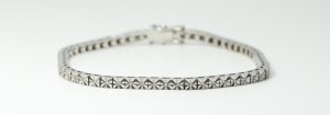 A 14k White Gold Round Diamond Tennis Bracelet with Pave Setting